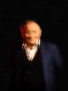 portrait of Peter Weibel ZKM director with long exposure and red light 