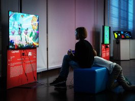 two children playing videogames in ZKM exhibition, reportage photography 